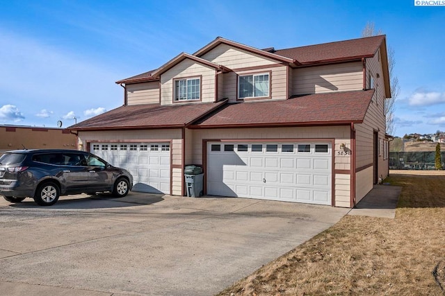 573-575 SE Shoemaker Pl, Pullman, WA 99163 - view of front of home featuring a garage, driveway, and a shingled roof
