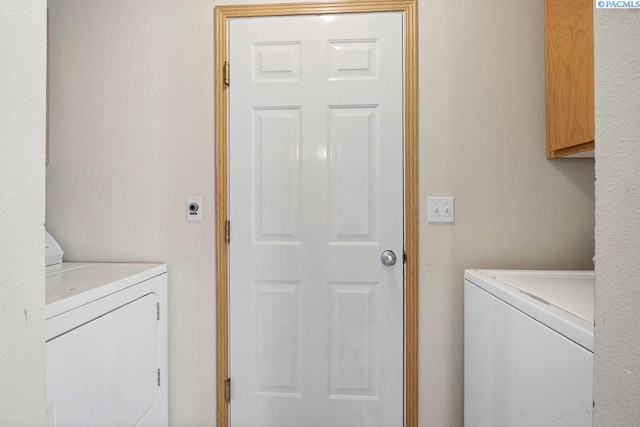 573-575 SE Shoemaker Pl, Pullman, WA 99163 - washroom with washer and clothes dryer and cabinet space