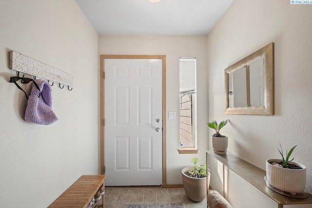 573-575 SE Shoemaker Pl, Pullman, WA 99163 - doorway to outside featuring baseboards
