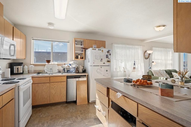 573-575 SE Shoemaker Pl, Pullman, WA 99163 - kitchen with white appliances, light countertops, and stone finish flooring