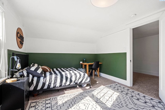 bedroom with carpet and lofted ceiling