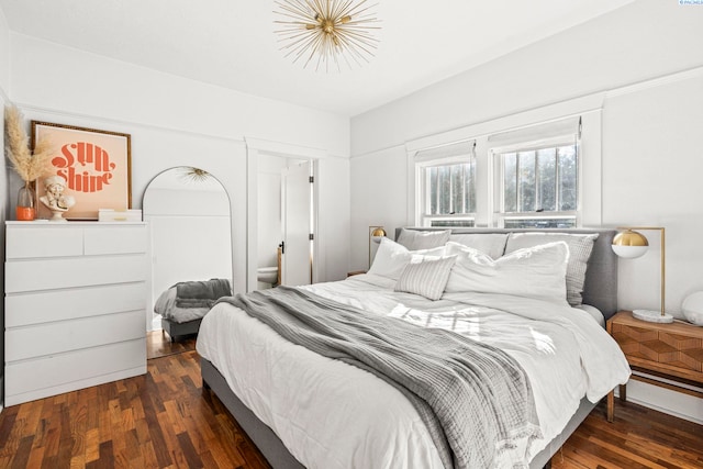 bedroom featuring dark wood-type flooring