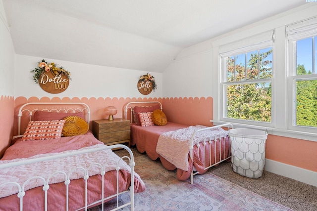 bedroom with lofted ceiling and carpet flooring