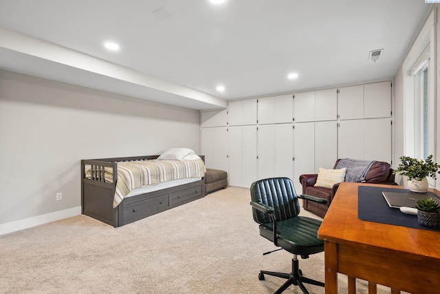 bedroom with light colored carpet