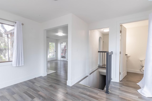 615 SW Winter Cir, Pullman, WA 99163 - corridor featuring wood finished floors, baseboards, and an upstairs landing