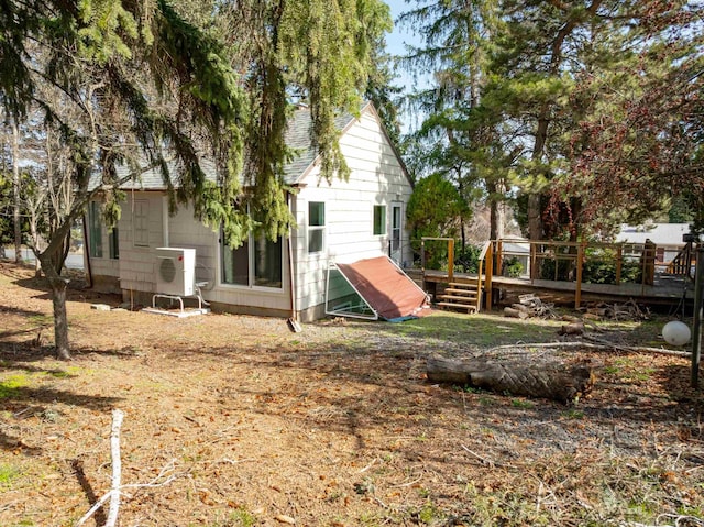 615 SW Winter Cir, Pullman, WA 99163 - back of property with a cooling unit, a deck, and roof with shingles