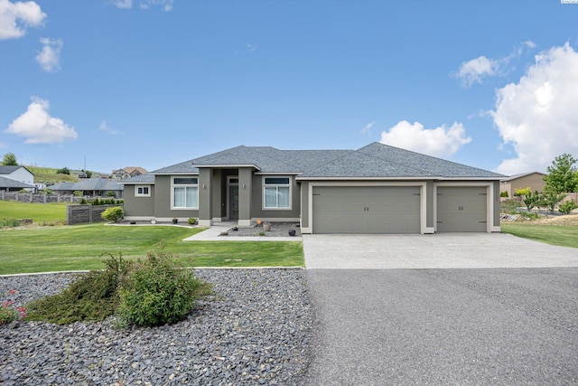 view of front of house featuring stucco siding, an attached garage, driveway, and a shingled roof