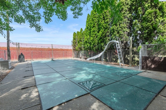 view of pool featuring a water slide