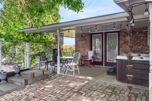 view of patio / terrace featuring a hot tub