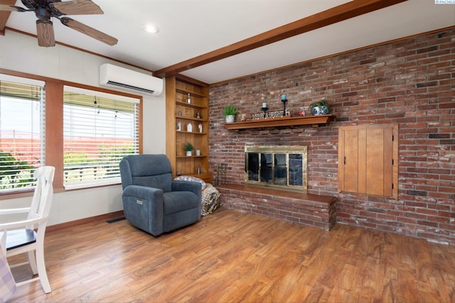 living room with a fireplace, beamed ceiling, wood-type flooring, a wall unit AC, and built in shelves