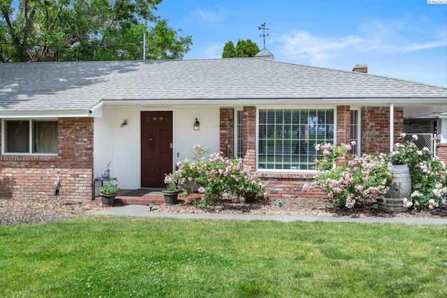 ranch-style home with a front yard