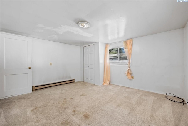 836 Main St, Prosser, WA 99350 - unfurnished bedroom featuring baseboard heating, carpet floors, and a closet
