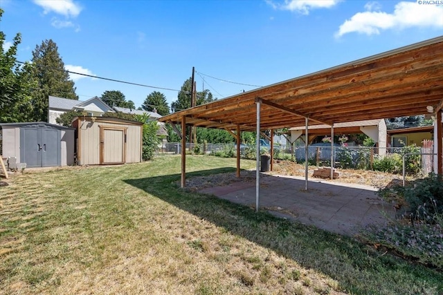 836 Main St, Prosser, WA 99350 - fenced backyard with a storage unit and a patio area