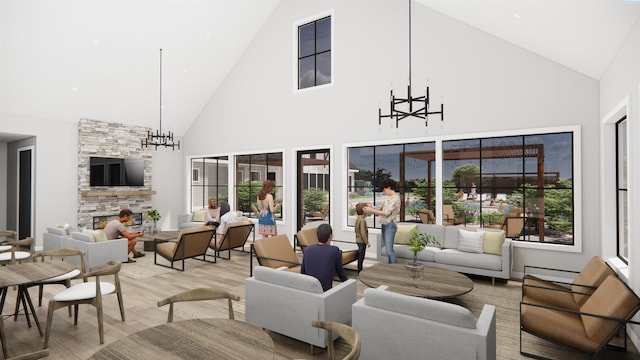 living room featuring a notable chandelier, a stone fireplace, light hardwood / wood-style floors, and high vaulted ceiling