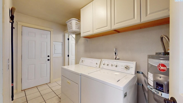 laundry room featuring cabinet space, light tile patterned floors, washing machine and dryer, and electric water heater