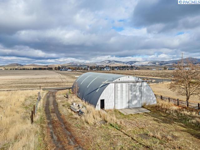 exterior space featuring a rural view and a mountain view