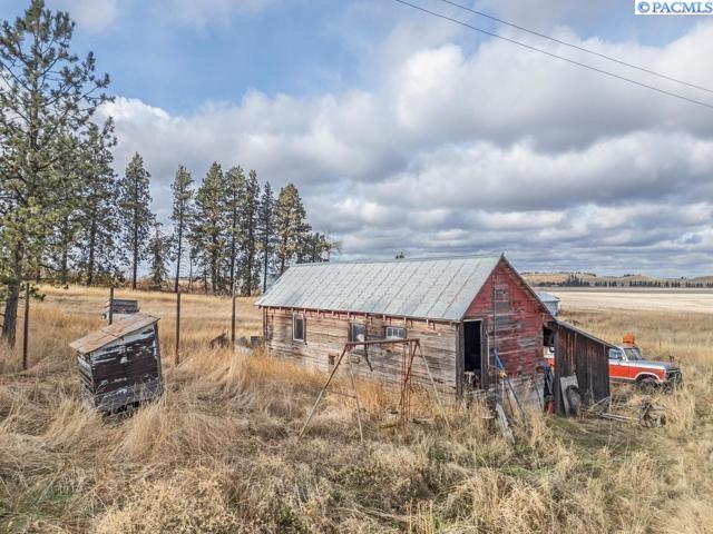 view of outbuilding with a rural view