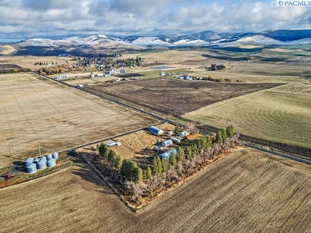 birds eye view of property with a rural view and a mountain view