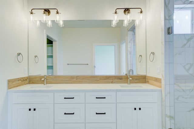9418 Balflour Ct, Pasco, WA 99301 - bathroom featuring a marble finish shower and double vanity