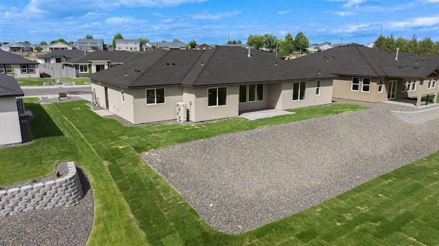 9418 Balflour Ct, Pasco, WA 99301 - rear view of property featuring a residential view, stucco siding, and a shingled roof
