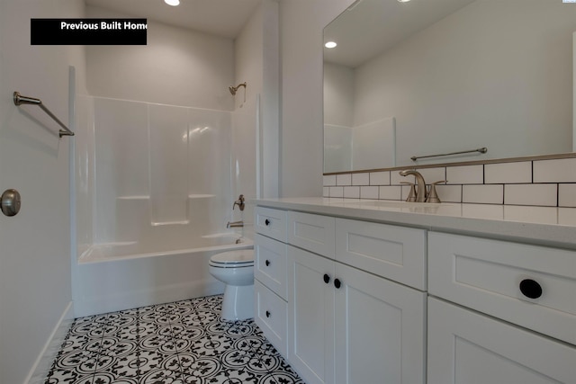 bathroom featuring tile patterned flooring, toilet, vanity, shower / bathing tub combination, and backsplash