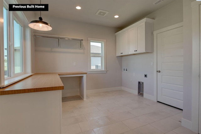 laundry room featuring recessed lighting, hookup for an electric dryer, washer hookup, visible vents, and cabinet space