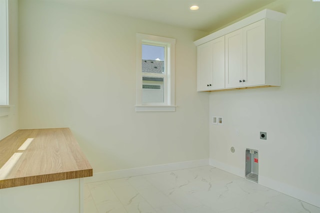 9418 Balflour Ct, Pasco, WA 99301 - washroom featuring hookup for an electric dryer, cabinet space, light marble finish floors, baseboards, and hookup for a washing machine