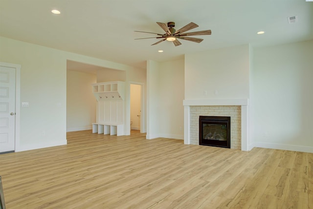 9418 Balflour Ct, Pasco, WA 99301 - unfurnished living room with light wood-style floors, a ceiling fan, a brick fireplace, baseboards, and recessed lighting