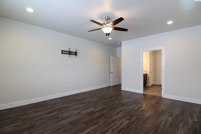 unfurnished bedroom with dark wood-style floors, baseboards, recessed lighting, ensuite bathroom, and a ceiling fan