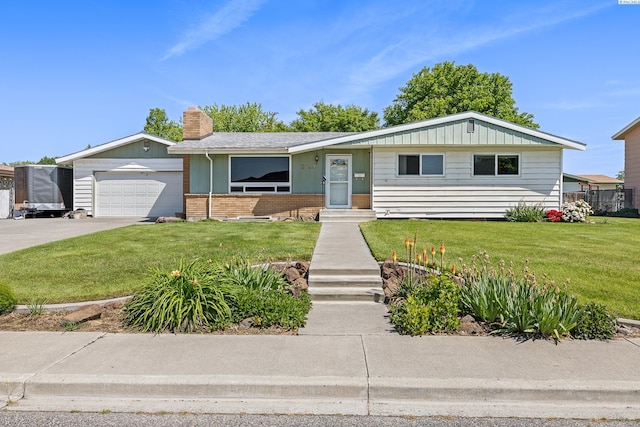 2120 Austin St, Richland, WA 99354 - view of front of property featuring a chimney, board and batten siding, brick siding, and a front yard