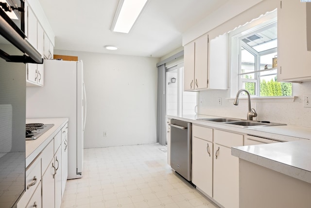 2120 Austin St, Richland, WA 99354 - kitchen featuring a sink, light flooring, light countertops, and appliances with stainless steel finishes