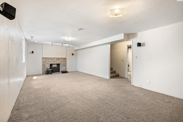 2120 Austin St, Richland, WA 99354 - unfurnished living room featuring stairs, carpet flooring, and a brick fireplace