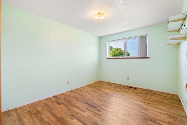 2120 Austin St, Richland, WA 99354 - unfurnished room featuring wood finished floors and baseboards