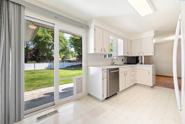 2120 Austin St, Richland, WA 99354 - kitchen with dishwasher, light floors, plenty of natural light, and light countertops