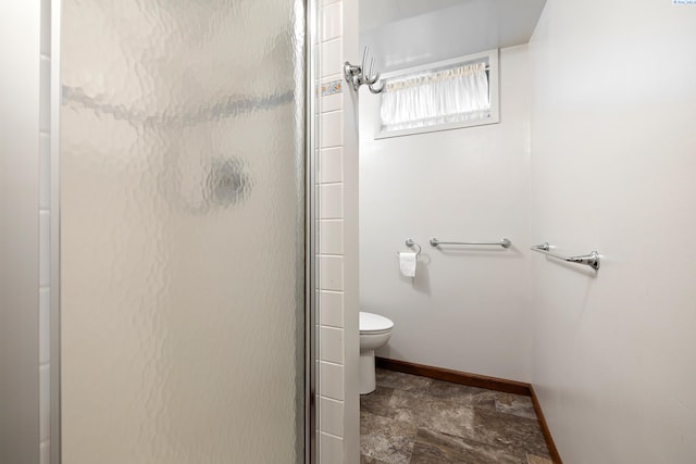 2120 Austin St, Richland, WA 99354 - bathroom featuring toilet, a shower stall, and baseboards