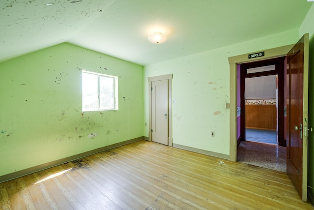 212 C St, Endicott, WA 99125 - empty room featuring light wood-style flooring and vaulted ceiling