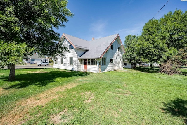 212 C St, Endicott, WA 99125 - view of property exterior featuring a yard and a metal roof