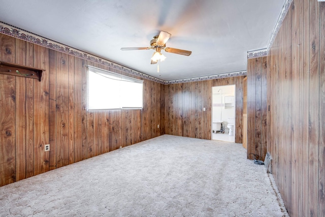 212 C St, Endicott, WA 99125 - carpeted empty room featuring ceiling fan and wood walls