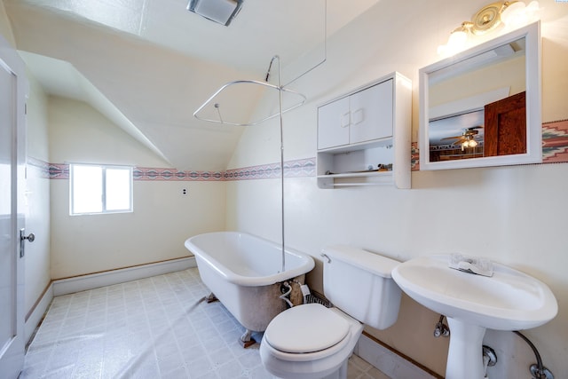 212 C St, Endicott, WA 99125 - bathroom with a freestanding bath, vaulted ceiling, tile patterned floors, and ceiling fan