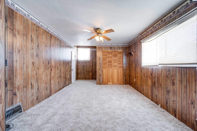 212 C St, Endicott, WA 99125 - carpeted spare room featuring wood walls and a ceiling fan
