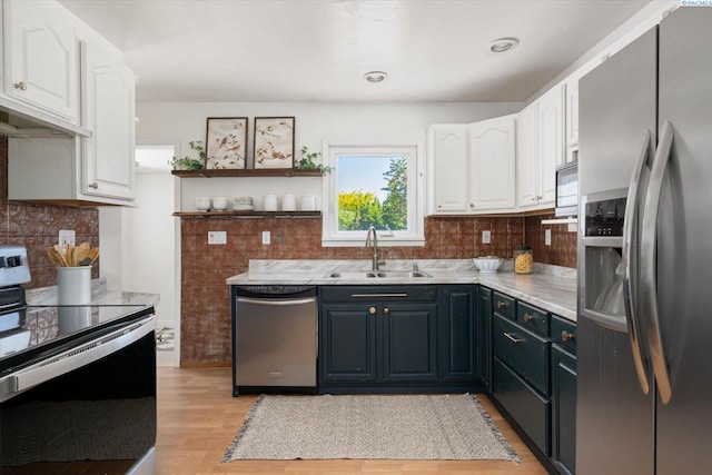 3011 W Hood Ave, Kennewick, WA 99336 - kitchen with stainless steel appliances, a sink, white cabinetry, and open shelves