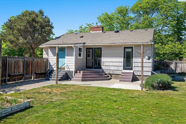 3011 W Hood Ave, Kennewick, WA 99336 - back of property featuring entry steps, a chimney, and roof with shingles