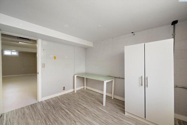 3011 W Hood Ave, Kennewick, WA 99336 - basement with light wood-style flooring, concrete block wall, and baseboards