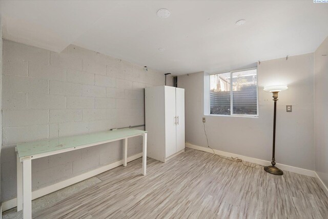 3011 W Hood Ave, Kennewick, WA 99336 - below grade area with wood finished floors, baseboards, and concrete block wall