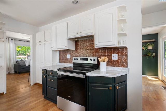 3011 W Hood Ave, Kennewick, WA 99336 - kitchen with stainless steel electric stove, white cabinetry, light wood-type flooring, and open shelves