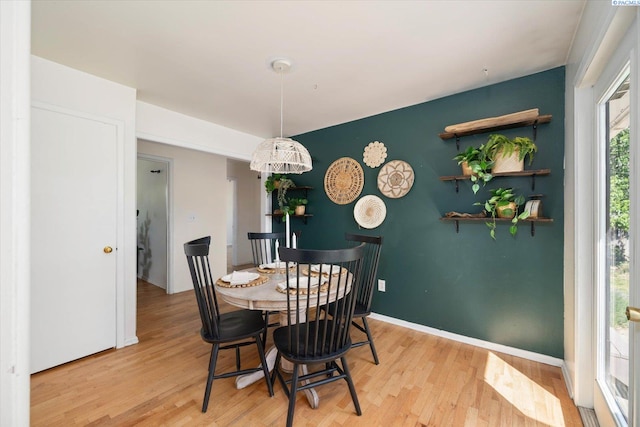 3011 W Hood Ave, Kennewick, WA 99336 - dining space featuring light wood finished floors, baseboards, and an accent wall
