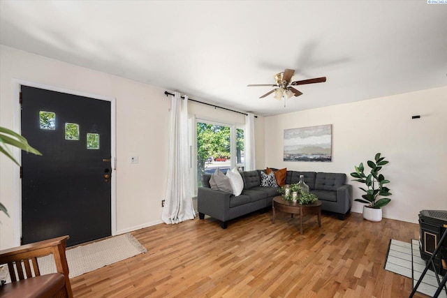3011 W Hood Ave, Kennewick, WA 99336 - living area with ceiling fan, light wood-style flooring, and baseboards
