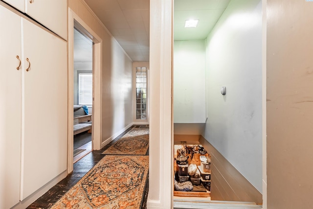 corridor featuring dark wood-type flooring