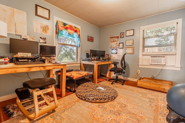 office space featuring ornamental molding, wood-type flooring, and cooling unit