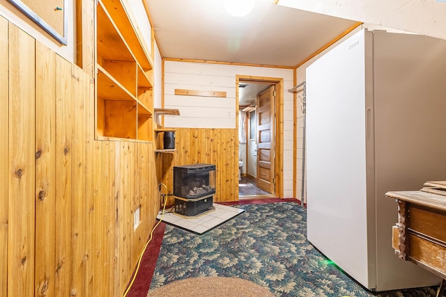 corridor with carpet floors and wood walls